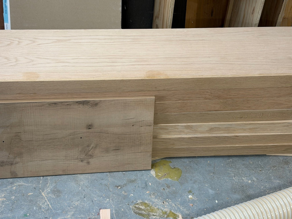 Finished shelves stacked in the Texas workshop