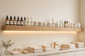 Custom lit white oak spa back-bar shelf — open storage