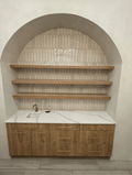Animated: three white oak shelves in an arched niche, lights fading on